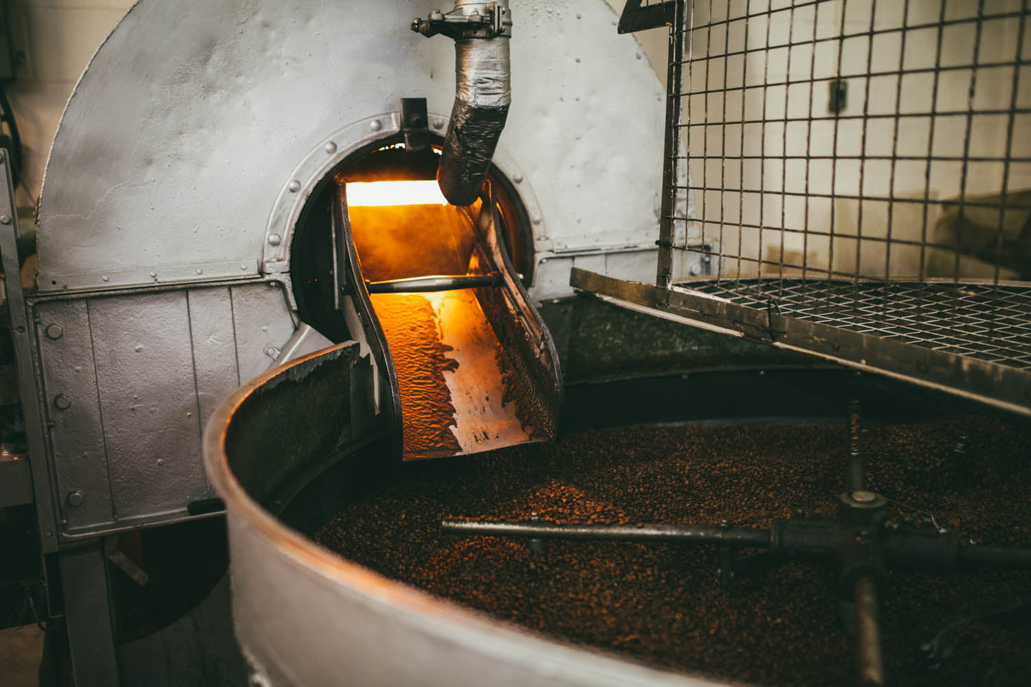 Flames roasted coffee on our 1960's whitmee roaster